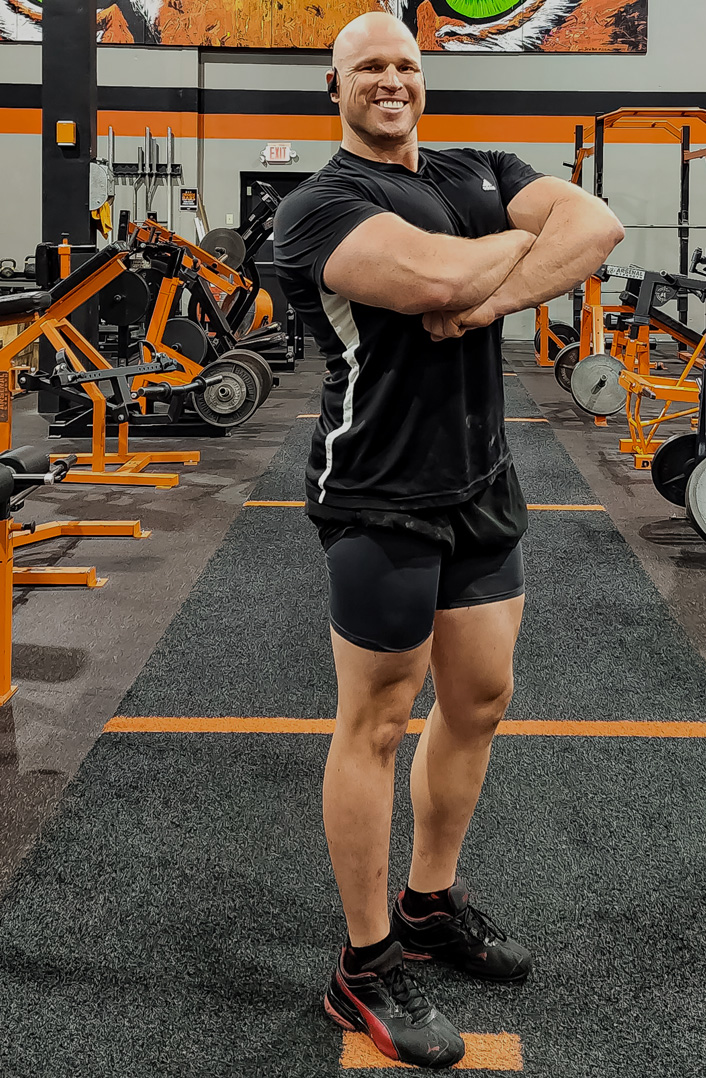 Coach is smiling with his pose.